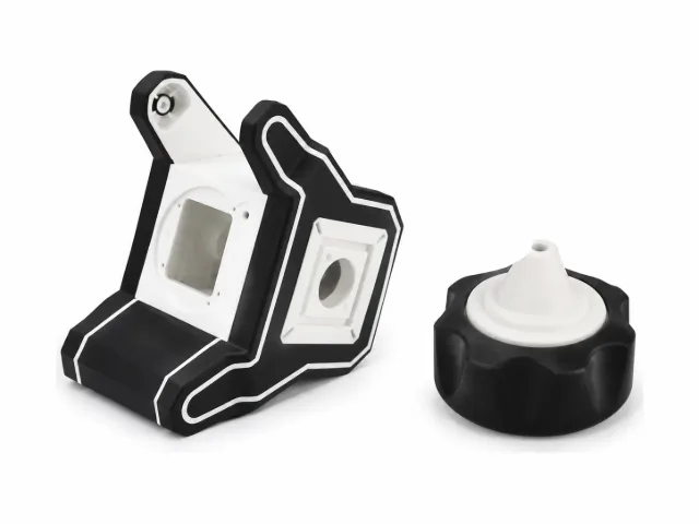 Two-shot overmolded parts with black TPE over white rigid plastic